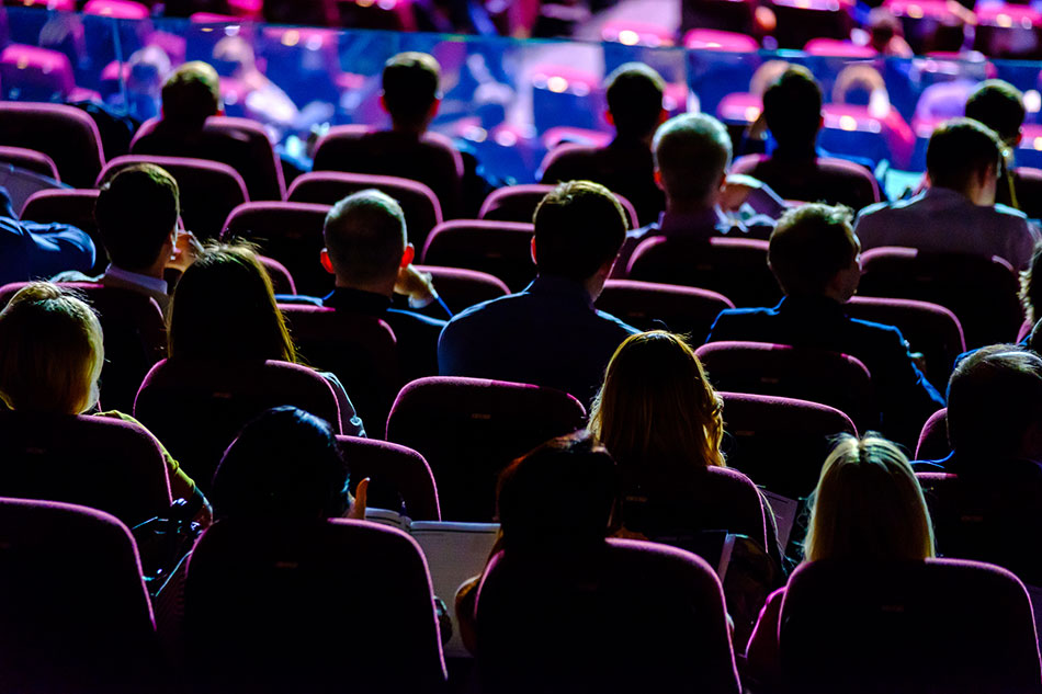 Annual AA Conference - Audience sitting in a conference hall in the dark