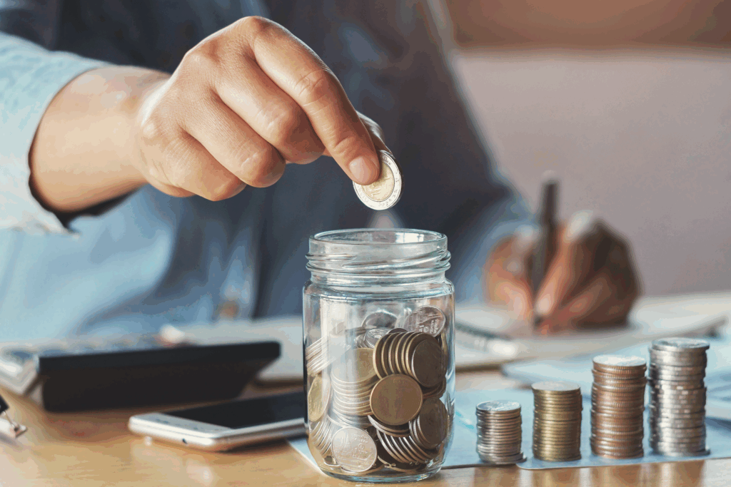 Gratitude Week 2025 - image of man adding coins to a jar